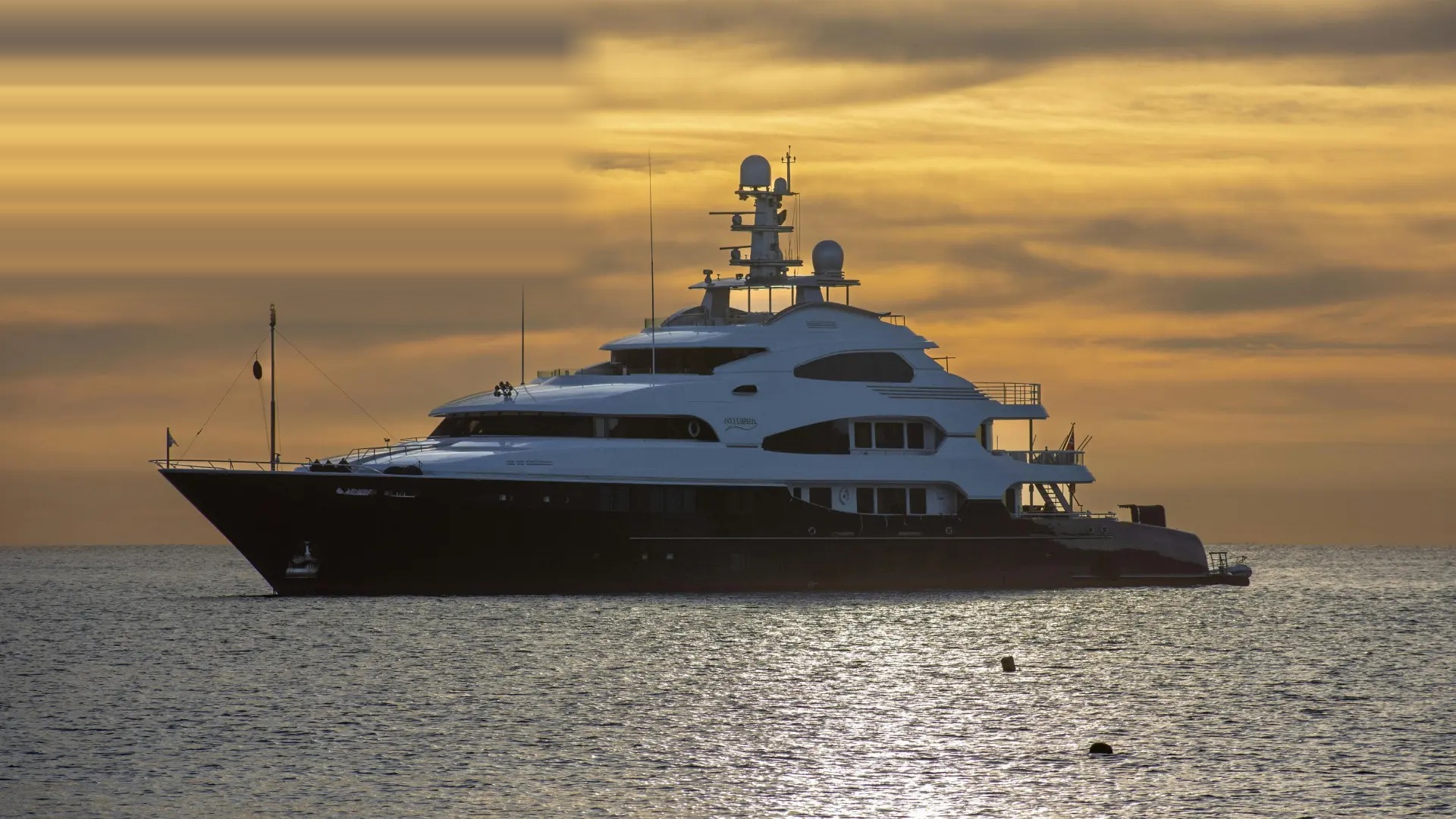Superyacht anchored offshore at sunset in Fort Lauderdale